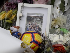 A tribute for mosque shooting victim Tariq Omar is placed at the Botanical Gardens in Christchurch, New Zealand, Thursday, March 21, 2019. Thousands of people were expected to come together for an emotional Friday prayer service led by the imam of one of the two New Zealand mosques where 50 worshippers were killed in a white supremacist attack on Friday March 15.