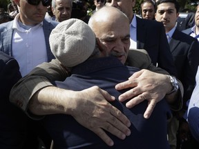 His Royal Highness Prince El Hassan bin Talal Hashemite, of the Kingdom of Jordan, embraces a worshipper outside the Al Noor mosque in Christchurch, New Zealand, Saturday, March 23, 2019. The mosque reopened today following the March 15 mass shooting.