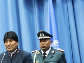 Bolivia's President Evo Morales, left, delivers a speech during the 62nd session of the commission on narcotic drugs of the 'United Nations Office on Drugs and Crime' (UNODC), at the International Center in Vienna, Austria, Thursday, March 14, 2019.