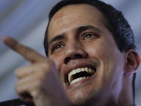 Venezuela's self-proclaimed interim president Juan Guaido talks during a meeting with electricity experts in Caracas, Venezuela, Thursday, March 28, 2019. The Venezuelan government on Thursday said it has barred Guaido from holding public office for 15 years, though the National Assembly leader responded soon afterward that he would continue his campaign to oust President Nicolas Maduro.