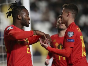 Belgium player Michy Batshuayi, left, celebrates a goal against Cyprus during the Euro 2020 group I qualifying soccer match between Cyprus and Belgium at the GSP stadium in Nicosia, Cyprus, Sunday, March 24, 2019.