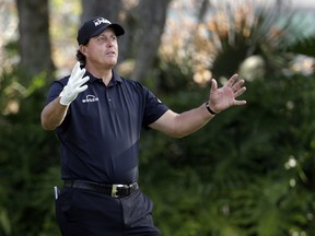 Phil Mickelson gestures as he waits his turn to tee off on the 13th hole during the first round of The Players Championship golf tournament Thursday, March 14, 2019, in Ponte Vedra Beach, Fla.