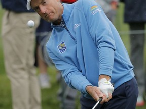 Jim Furyk chips to the fifth hole during the final round of The Players Championship golf tournament Sunday, March 17, 2019, in Ponte Vedra Beach, Fla.