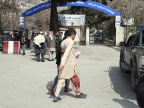An injured man is taken to a hospital in Kabul, Afghanistan, Thursday, March 21, 2019. An Afghan official says three explosions have struck near a Shiite shrine and cemetery in western Kabul as people gathered there to mark the holiday of Nowruz, the Persian New Year.
