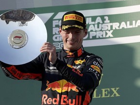 Red Bull driver Max Verstappen of the Netherlands holds up his trophy after coming third in the Australian Formula 1 Grand Prix in Melbourne, Australia, Sunday, March 17, 2019.
