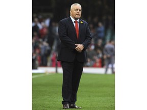 FILE - In this file photo dated Saturday, Feb. 23, 2019, Wales head coach Warren Gatland watches his players ahead of their Six Nations rugby union international between against England at the Principality Stadium in Cardiff, Wales.  Gatland has been hammering home to his Wales side to relish their uncommon shot at a Six Nations Grand Slam, ahead of their deciding match against Ireland on upcoming Saturday March 16, 2019.