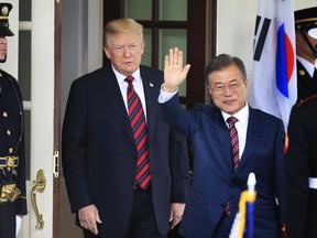 FILE - In this May 22, 2018, file photo, South Korean President Moon Jae-in waves as he is welcomed by U.S. President Donald Trump to the White House in Washington. South Korea said on Friday, March 29, 2019, Moon will travel to the United States on April 10-11 to meet with Trump for a summit on North Korean nuclear diplomacy.