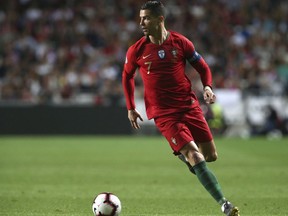 Portugal's Cristiano Ronaldo controls the ball during the Euro 2020 group B qualifying soccer match between Portugal and Serbia at the Luz stadium in Lisbon, Portugal, Monday, March 25, 2019.