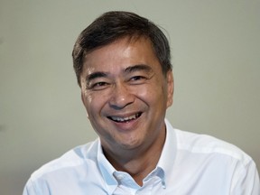 The leader of Thailand's Democrat Party Abhisit Vejjajiva talks to The Associated Press reporters during an interview Wednesday, March 20, 2019. in Bangkok, Thailand. Abhisit says if he becomes prime minister after Sunday's election, he'll make careful but forceful efforts to undo undemocratic constitutional clauses imposed by the military government that took power in 2014.