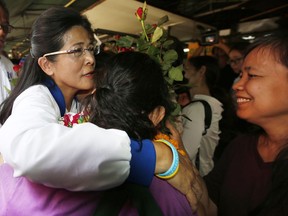 In this Thursday, March 21, 2019, photo, supporters hug the leader of the Pheu Thai Party and candidate for prime minister Sudarat Keyuraphan during an election rally in Bangkok, Thailand. The political movement that has won every Thai election in nearly two decades is facing its biggest test yet: Squaring off against the allies of the military junta that removed it from power and rewrote the electoral rules with the goal of putting an end to those victories.