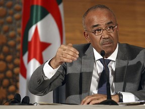Algeria's new prime minister Noureddine Bedoui gives a press conference, in Algiers, Algeria, Thursday, March 14, 2019. Algeria's new prime minister is promising to create a government within days as the country faces mass protests calling on President Abdelaziz Bouteflika to step down.