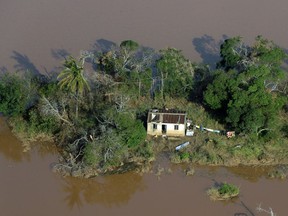 A house is surrounded by flood water near Beira, Mozambique.