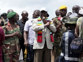 Zimbabwean President Emmerson Mnangagwa addresses affected vilagers during his visit to Chimanimani about 600 kilometres south east of Harare, Zimbabwe, Wednesday, March, 20, 2019. Mnangagwa visited a part of Chimanimnani affected by cyclone Idai and promised assitance in the form of food and rebuilding of homes. Hundreds are dead, many more missing and thousands at risk from massive flooding in Mozambique, Malawi and Zimbabwe caused by Cyclone Idai.