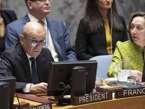 Jean-Yves Le Drian, United Nations Security Council president, speaks at the UN headquarters about threats to international peace and security caused by terrorist acts, Thursday, March 28, 2019. The U.N. Security Council has unanimously adopted a resolution aimed at strengthening global efforts to combat the numerous and new ways that terrorist groups raise funds to finance their operations. The French-drafted resolution approved Thursday orders all countries to ensure that their domestic laws are sufficient to prosecute and penalize those responsible for directly or indirectly financing "terrorist organizations or individual terrorists for any purpose." At right is Hasmik Egian, Director of the Security Council Affairs Division of the Department of Political and Peacebuilding Affairs.