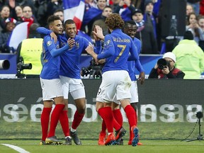 France's Kylian Mbappe, second from right, celebrates after scoring his side's third goal during the Euro 2020 group H qualifying soccer match between France and Iceland at Stade de France stadium in Saint Denis, outside Paris, France, Monday, March 25, 2019.