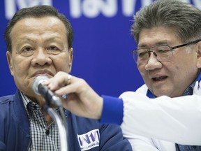 Senior leaders of Pheu Thai party, from left Virot Pao-In, leader and Phumtam Wechayachai, Secretary General hold a press conference at party head quarters in Bangkok, Thailand, Sunday, March 24, 2019. Figures from Thailand's Election Commission show a military-backed party has taken the lead in the country's first election since a 2014 coup.