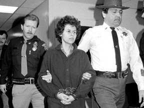 In this Nov. 24, 1981 file photo, Weather Underground member Judith Clark is escorted into Rockland County Courthouse in New City, N.Y.