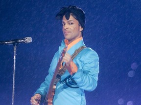 In this Feb. 4, 2007 file photo, Prince performs during the halftime show at the Super Bowl XLI football game at Dolphin Stadium in Miami.