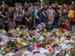 choolchildren and other well-wishers view flowers and tributes near Al Noor mosque on March 18, 2019 in Christchurch, New Zealand.