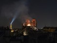 Smoke and flames rise from Notre-Dame Cathedral on April 15, 2019 in Paris, France. A fire broke out on Monday afternoon and quickly spread across the building, collapsing the spire.