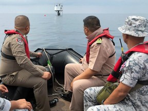 Thai naval officers and marine police inspect a ‘seastead’ in the Andaman Sea off the coast of Phuket island, southern Thailand.