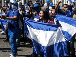 Opposition demonstrators protest against President Daniel Ortega's government, called by the opposition united front "Blue and White National Unity" in Managua.