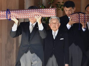 Japan's Emperor Akihito (C) leaves the outer shrine of Ise Jingu Shrine in Ise in the central Japanese prefecture of Mie on April 18, 2019, as he takes part in a series of rituals ahead of his abdication.