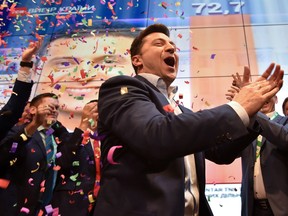 Ukrainian comedian and presidential candidate Volodymyr Zelensky reacts after the announcement of the first exit poll results in the second round of Ukraine's presidential election at his campaign headquarters in Kiev.