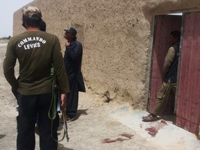 Pakistani security officials gather at the site of an attack by gunmen on a polio vaccination team in the town of Chaman in Balochistan province on April 25, 2019.