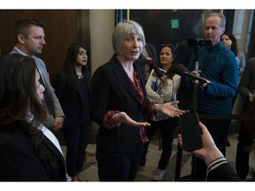 Minister of Small Business and Export Promotion Mary Ng, Liberal MP Francis Drouin, and Government House Leader Bardish Chagger (third from left) look on as Employment, Workforce Development and Labour Minister Patty Hajdu comments on the Ontario budget in the Foyer of the House of Commons in Ottawa, Friday April 12, 2019.
