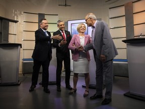 United Conservative Party leader Jason Kenney, left to right, Alberta Liberal Party leader David Khan, Alberta New Democrat Party leader and incumbent premier Rachel Notley and Alberta Party leader Stephen Mandel greet each before the start of the 2019 Alberta Leaders Debate in Edmonton, Alta., on Thursday, April 4, 2019.
