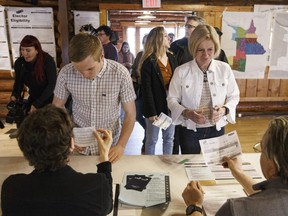 Alberta NDP Leader Rachel Notley and her son Ethan Arab vote in the provincial election in Edmonton on Tuesday, April 16, 2019.