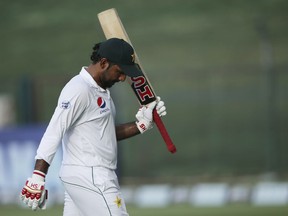 FILE  - In this Thursday, Oct 18, 2018 file photo, Pakistan's Sarfaraz Ahmed leaves the field after his dismissal against Australia during their test match in Abu Dhabi, United Arab Emirates. Captain Sarfaraz Ahmed likes that Pakistan is considered an underdog entering the World Cup beginning next month, May, 2019 in England but insisted that despite the label, the 15-member squad is well prepared. Pakistan was ranked last in the Champions Trophy two years ago but won the eight-team event under Ahmed's captaincy.