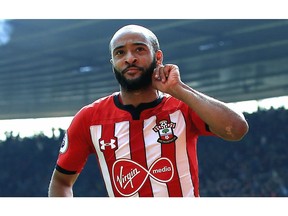 Southampton's Nathan Redmond, left, celebrates scoring his side's first goal of the game, during the English Premier League soccer match between Southampton and Wolverhampton Wanderers,  at St Mary's Stadium, in Southampton, England, Saturday April 13, 2019.