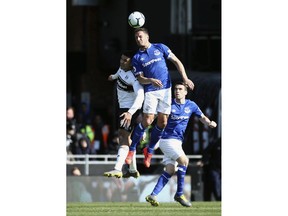 Fulham's Aleksandar Mitrovic, left  and Everton's Phil Jagielka battle for the ball, during the English Premier League soccer match between Fulham and Everton at Craven Cottage, in London,  Saturday April 13, 2019.