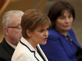 First Minister of Scotland Nicola Sturgeon issues a statement on Brexit and independence in the main chamber at the Scottish Parliament, Edinburgh, Wednesday April 24, 2019. Sturgeon says she wants to hold a new referendum on independence from the U.K. by 2021 if Britain leaves the European Union, though she acknowledges she lacks the power to make it happen on her own. Scots voted against independence by 55% to 45% in a 2014 referendum billed as a once-in-generation poll.