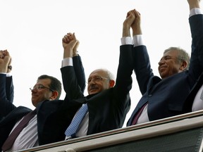 Ekrem Imamoglu, the main Turkish opposition Republican People's Party, CHP, candidate for Istanbul, right, CHP leader Kemal Kilicdaroglu, center, and the new Ankara Mayor from CHP, Mansur Yavas, salute supporters, in Ankara, Turkey, Tuesday, April 2, 2019. Turkish President Recep Tayyip Erdogan's ruling party is appealing the results of the local elections in Istanbul, where the opposition has a razor-thin lead.