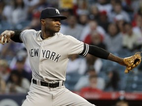 New York Yankees starting pitcher Domingo German throws against the Los Angeles Angels during the first inning of a baseball game in Anaheim, Calif., Tuesday, April 23, 2019.