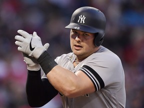 New York Yankees' Luke Voit claps as he scores after hitting a solo home run during the first inning of a baseball game against the Los Angeles Angels, Monday, April 22, 2019, in Anaheim, Calif.