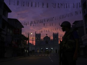 A Sri Lankan soldier stands guard in front St. Anthony's Church in Colombo, Sri Lanka, Friday, April 26, 2019.