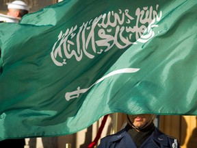 In this March 22, 2018 file photo, an Honor Guard member is covered by the flag of Saudi Arabia as Defense Secretary Jim Mattis welcomes Saudi Crown Prince Mohammed bin Salman to the Pentagon with an Honor Cordon, in Washington Saudi Arabia’s Interior Ministry said Tuesday, April 23, 2019, that 37 Saudi citizens have been beheaded in a mass execution that took place across various regions of the country. Saudi King Salman ratified the executions for terrorism-related crimes by royal decree.