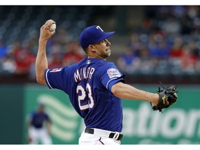 Texas Rangers starting pitcher Mike Minor throws to a Los Angeles Angels batter during the first inning of a baseball game in Arlington, Texas, Tuesday, April 16, 2019.