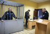 Oleg Smorodinov, seen here in a courtroom cage, told a New York Times reporter about a list of names of six Ukrainian men.