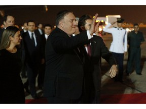 U.S. Secretary of State Mike Pompeo waves upon his arrival to the Silvio Pettirossi international airport, in Asuncion, Paraguay, Friday, April 12, 2019. Pompeo met Friday with Chile's president to address, mainly, the vast crisis that afflicts Venezuela in the first round of a tour that includes Paraguay, Peru and Colombia.