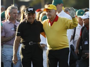 Jack Nicklaus and Gary Player acknowledge the crowd before hitting ceremonial tee shots on the first hole during the first round for the Masters golf tournament Thursday, April 11, 2019, in Augusta, Ga.