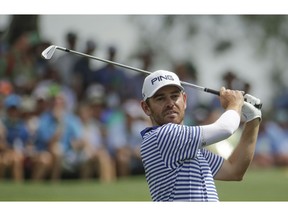 Louis Oosthuizen, of South Africa, hits from the third tee during the third round for the Masters golf tournament Saturday, April 13, 2019, in Augusta, Ga.