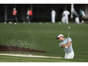 Rory McIlroy, of Northern Ireland, practices on the driving range at the Masters golf tournament Tuesday, April 9, 2019, in Augusta, Ga.
