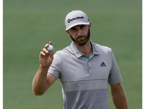 Dustin Johnson reacts on the second hole during the third round for the Masters golf tournament Saturday, April 13, 2019, in Augusta, Ga.