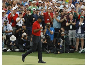 Tiger Woods reacts as he wins the Masters golf tournament Sunday, April 14, 2019, in Augusta, Ga.