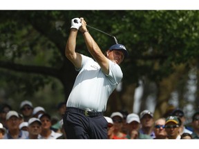 Phil Mickelson hits on the fourth hole during the first round for the Masters golf tournament Thursday, April 11, 2019, in Augusta, Ga.